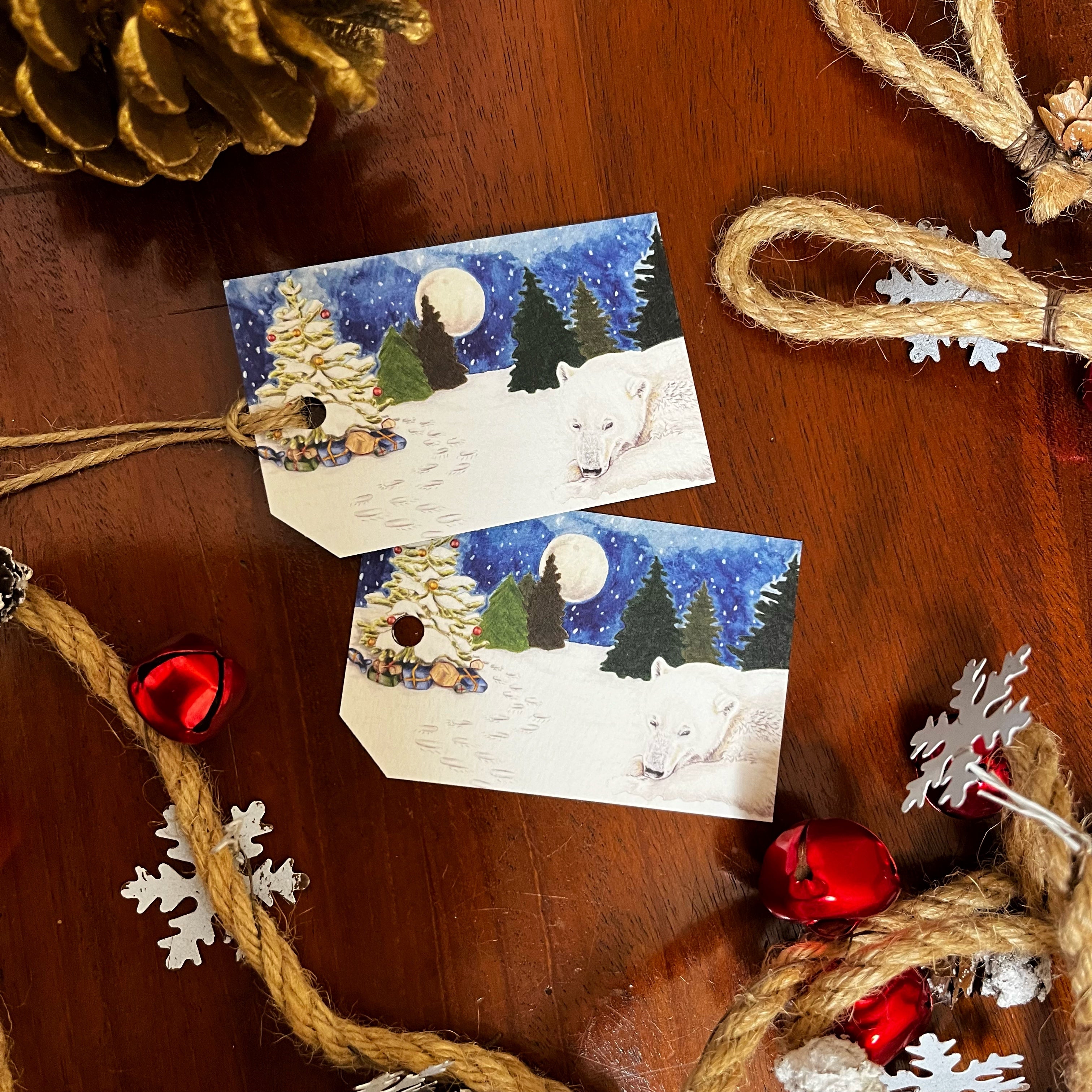 hand drawn polar bear sleeping next to a decorated christmas tree at night christmas gift tags